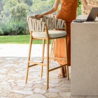 Distinguished Talenti Venice bar stool with light-toned teak wood and woven light-colored rope-like material construction