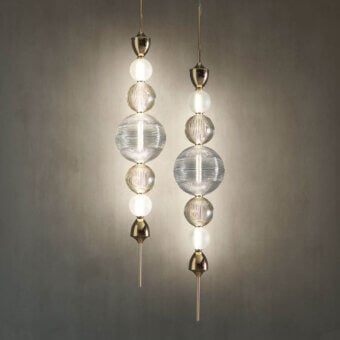 Distinguished Italamp Greta suspension lamp with hand-cut blown crystal diffusers and sleek light gold metal structure