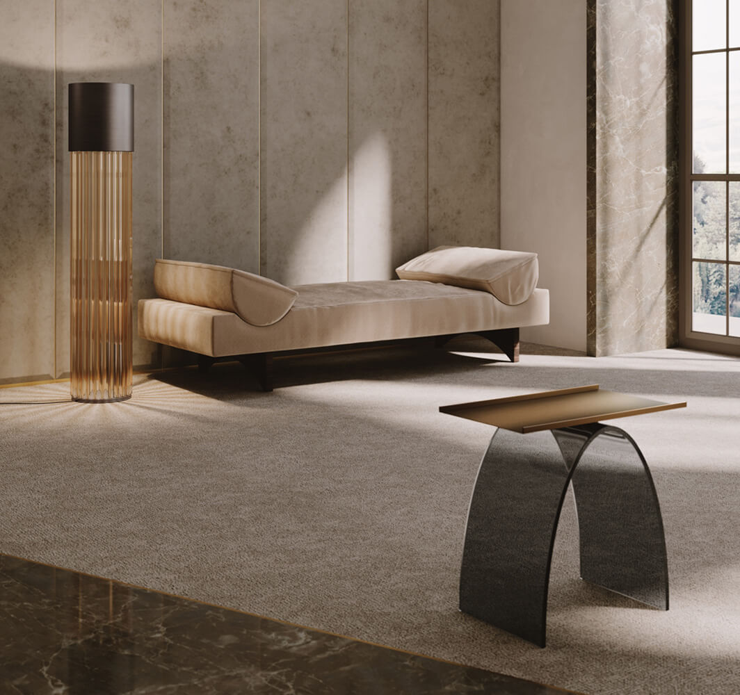 Floor lamp with amber ribbed glass and black shade beside a beige chaise lounge in a minimalist interior with marble flooring.