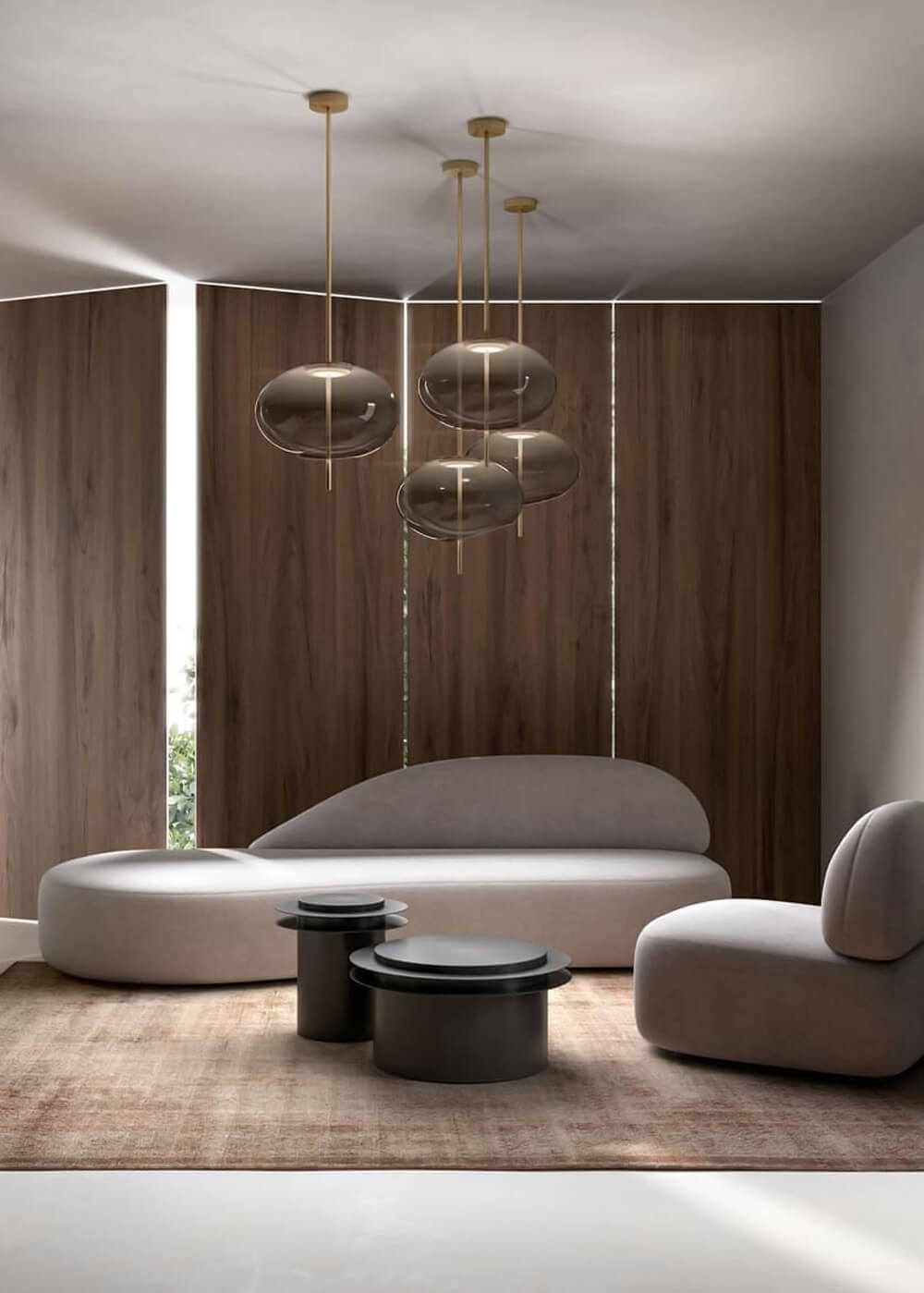 Suspension lamps with translucent gray shades and brass rods hang above a light gray sofa, dark wood paneling, and patterned rug in a modern living room.