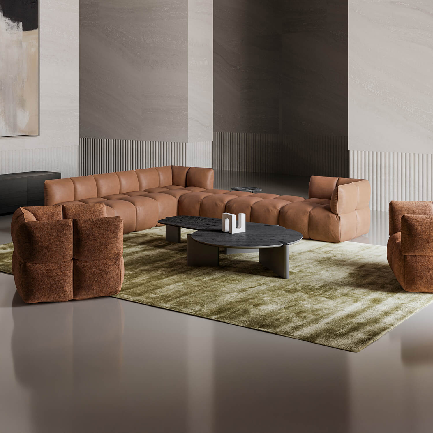 Leather sofa, tan color, quilted texture in a modern living room with stone columns, olive rug, and gray coffee table.