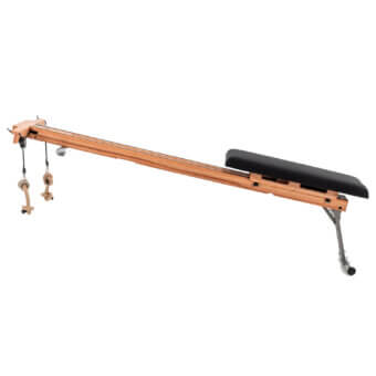 Wooden exercise apparatus with light-toned beam, black padded support, rope loops, and adjustable metal leg for stability.