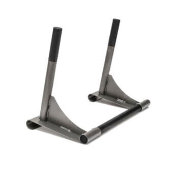 Gray metal stand with black cylindrical grips, angled upright supports, and a flat base, studio shot with matte finish.