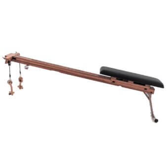 Vintage bed rest with reddish-brown wood frame, black cushion, adjustable rope supports, and silver metal leg.
