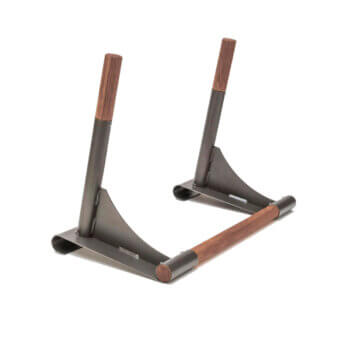 Dip bar station, bronze metal frame, walnut handles, triangular base, minimalist design, studio shot, matte finish, polished wood grain.