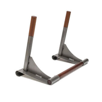 Metal dip stand with brushed gray finish, dark walnut handles, and angled cylindrical grips, featuring a rectangular base.