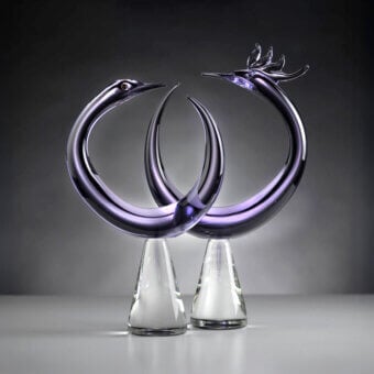 Purple glass phoenix sculptures by Duccio Di Segna on conical bases, displayed against a light-to-dark gray gradient backdrop.