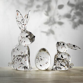Glass rabbit sculptures by Duccio Di Segna on wood, speckled clear glass, upright and seated poses with an egg shape.