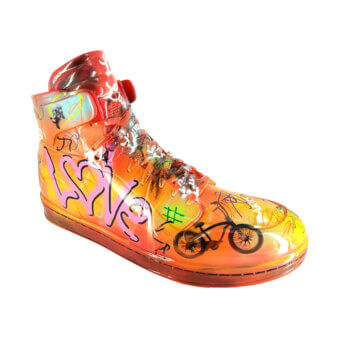 Distinguished Juliarte Sneaker sculpture handcrafted with stone powder and fiber glass in vibrant orange to red gradients with glossy finish