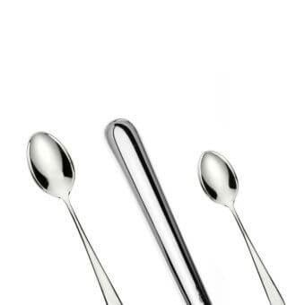 Stainless steel cutlery set by Schiavon, including two teaspoons and a serving spoon, with polished metallic finish and elongated handles.