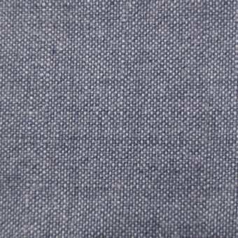 Woven denim fabric texture, muted blue-gray with heathered appearance, diagonal twill rib pattern, matte finish, neutral background.