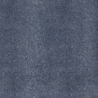 Blue-gray woven fabric texture with a fuzzy, mottled surface and tight construction, displaying subtle tonal variations under diffused lighting.