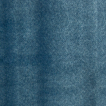 Teal woven fabric texture with a dense, matte finish and subtle mottled tonal variations, displaying a compact, uniform weave construction.