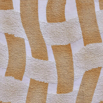 Textile pattern with golden-brown rectangles layered on cream, displaying dense woven and nubby textures with subtle contrast and organic structure.