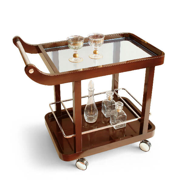 Bar cart, dark brown wood, two-tiered design with glass top, silver casters, polished metal handle, decorative trim, studio product shot.