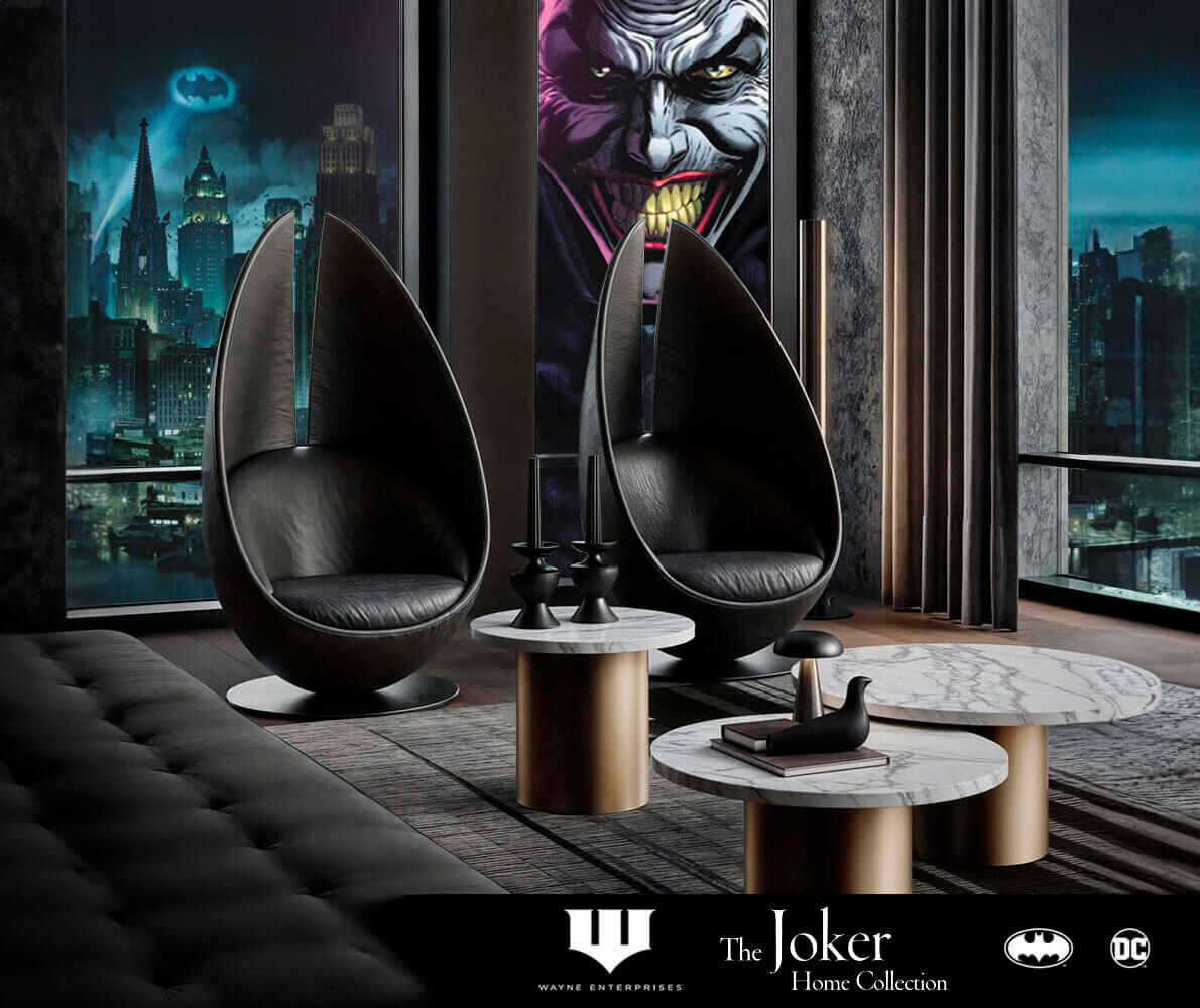 Gotham interior with gray tufted sofa, black pod chairs, marble tables, and Joker portrait, reflecting a dark, theatrical aesthetic.