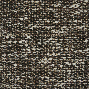 Textile with irregular dark brown and off-white weave, featuring a nubby texture and horizontal ridges across a dense, patterned surface.