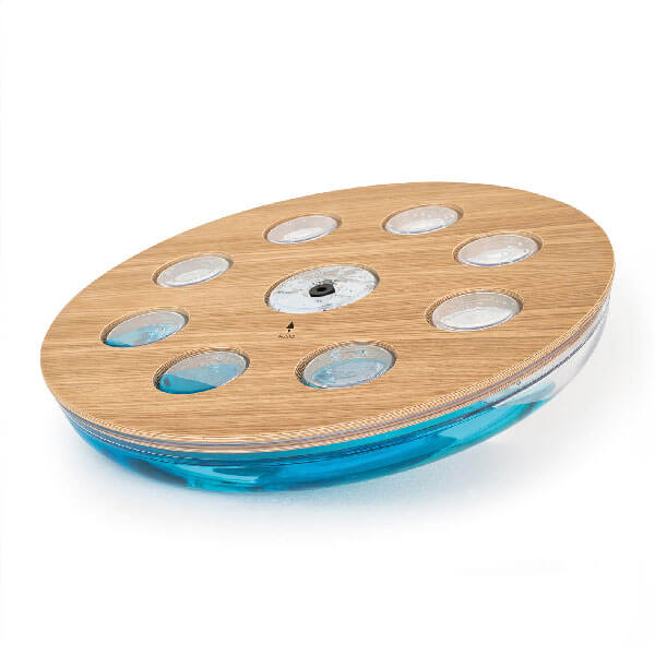 Floating platform with light wood top, eight circular cutouts, translucent blue reservoir, centered dark button, molded blue plastic base.