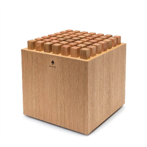 Wooden pencil organizer with sixty square blocks, light-toned wood grain, matte finish, and small tree graphic with “NC+RC” text.