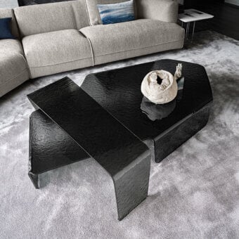 Distinguished Arketipo Chimera coffee table crafted in deep black curved and hammered glass with a glossy textured surface