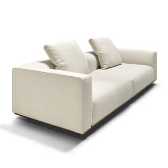 Distinguished Arketipo Hackman sofa with subtly textured off-white textile and sleek dark metal base