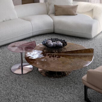Distinguished Arketipo Maverick coffee table with translucent tabletop and polished metal base exhibiting a rose tone with high-gloss finish