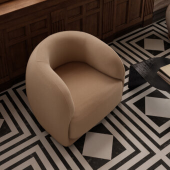 Distinguished Arketipo Touch Me lounge chair crafted in Italy with textured warm beige upholstery for enveloping comfort