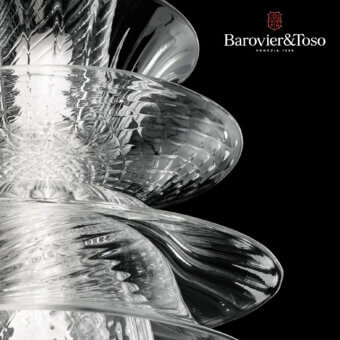 Barovier&Toso campanula lamp, clear glass, multi-layered bell shape with reflective, distorted surfaces and polished curves against a black background.