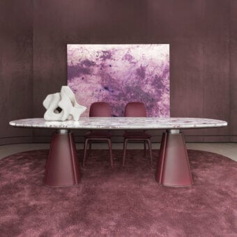 Distinguished Giorgetti Floria table with sculpted legs upholstered in burgundy leather and a polished marble top with grey veining