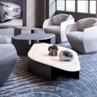 Distinguished Giorgetti Ligea coffee table—Maserati Edition—with white marble and matte dark-toned metal inspired by automotive air vents