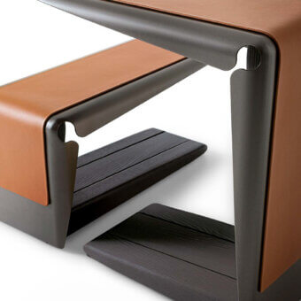 Superior Giorgetti Ploto side table with a curved painted metal structure and warm medium-brown wooden base in a matte finish