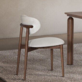 Refined Pacini & Cappellini Camilla chair with solid ash wood structure and light beige upholstery in satin finish