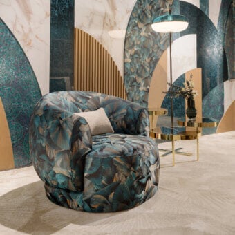 Lavish Sicis Botero lounge chair crafted with multilayer timber and polyurethane foam, featuring a teal and blue leaf pattern with gold accents