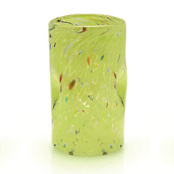 Green glass vase with spotted pattern, cylindrical shape, and mottled texture featuring brown, teal, orange, and yellow streaks.