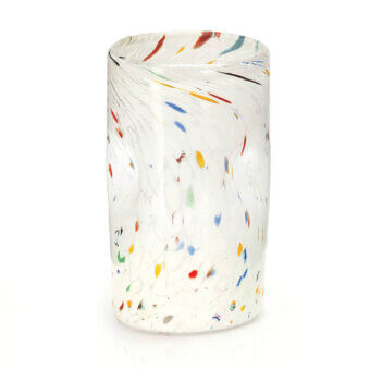 Glass cylinder with speckled pattern, transparent body, milky white base, multicolored inclusions, rounded form, studio lighting.