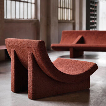 Exceptional Acerbis Trench lounge chair in textured terracotta upholstery with a flowing sculptural form crafted in Italy
