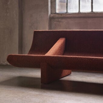 Avant-garde Acerbis Trench sofa with a muted reddish-brown textured textile and seemingly suspended structure