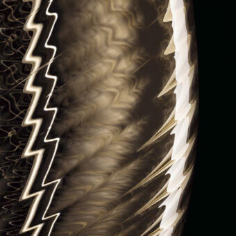 Perseus lamp graphic, marbled brown and beige background, white lightning bolts, fragmented feather-like shapes, black border.