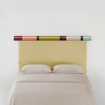 Exquisite Bolzan Letti Rosary headboard crafted with pale yellow velvet upholstery and cylindrical bands in burgundy, olive, pink, grey, teal hues