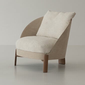 Superior Cierre1972 Catarina lounge chair with neutral beige textile and solid walnut legs in a matte finish