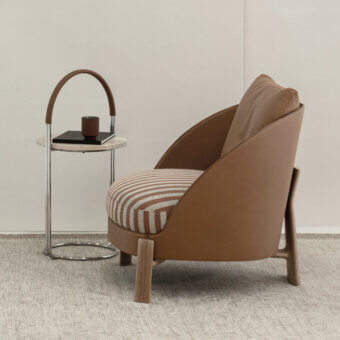 Distinguished Cierre1972 Otto side table with slim metal frame and smooth tan hand-wrapped leather cord finish