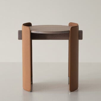 Superior Cierre1972 Maori side table with circular wood tabletop and textured medium-brown leather legs in satin finish