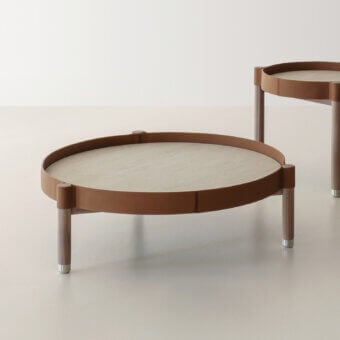 Elegant Cierre1972 Miro coffee table with light stone, rich brown leather and warm satin-finish wooden legs