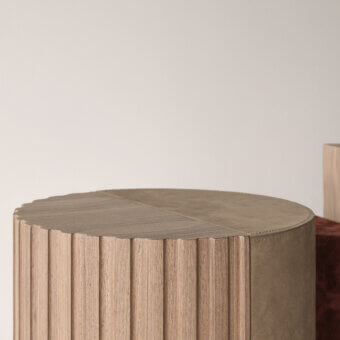 Elegant Cierre1972 Twins side table in light beige wood with a muted olive green uniquely stitched tabletop