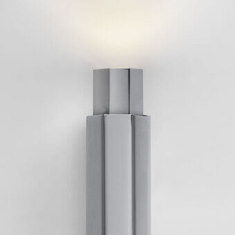 Exceptional Euroluce Castel wall lamp crafted in metal with satin gray finish, exhibiting layered form and subtle gradient illumination