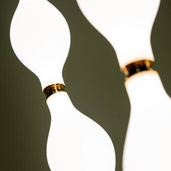 Distinguished Euroluce Dewy suspension lamp with organically shaped translucent white glass shades and polished brass-colored fittings