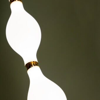 Distinguished Euroluce Dewy suspension lamp crafted in opaque white glass with polished golden metallic fitting for uninterrupted radiance