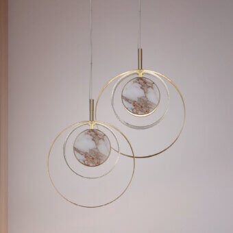 Exceptional Euroluce Eclissi suspension lamp with overlapping brushed gold-tone metal rings and hand-cut diamond effect glass