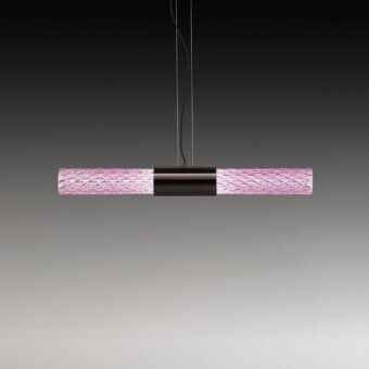 Suspension lamp, pink glass, cylindrical shape with diamond texture, silver cord, dark metal accents, minimalist modern design.