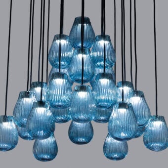 Exceptional Euroluce Gocce suspension lamp crafted in translucent blue hand-blown glass with a textured ribbed surface